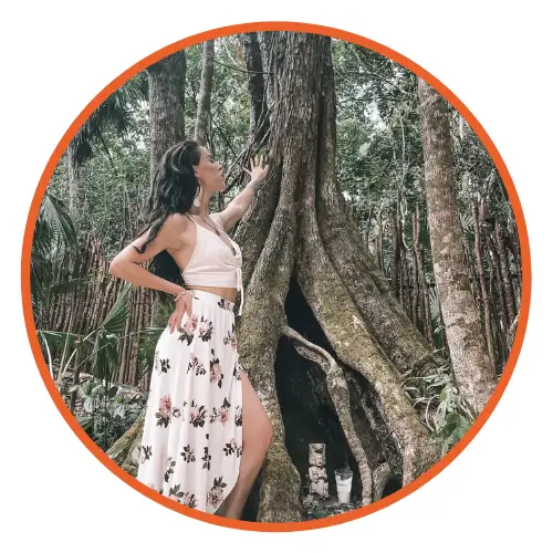 An image of reviewer, Stephanie Boland, posing near a tree.