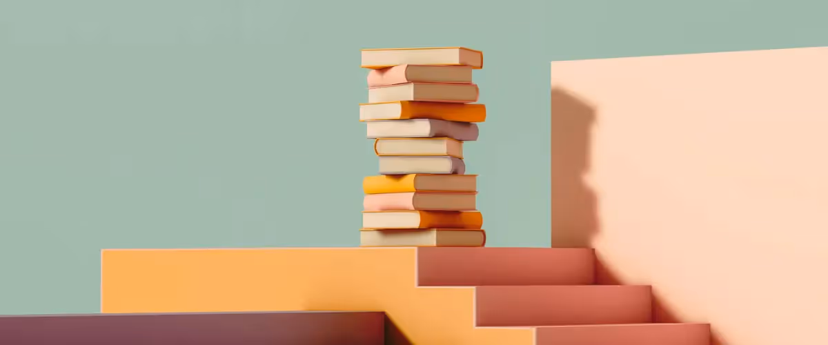 A pile of books on a colorful set of stairs.