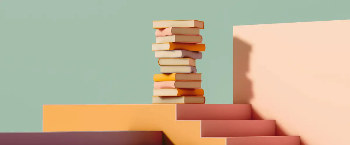 A pile of books on a colorful set of stairs.