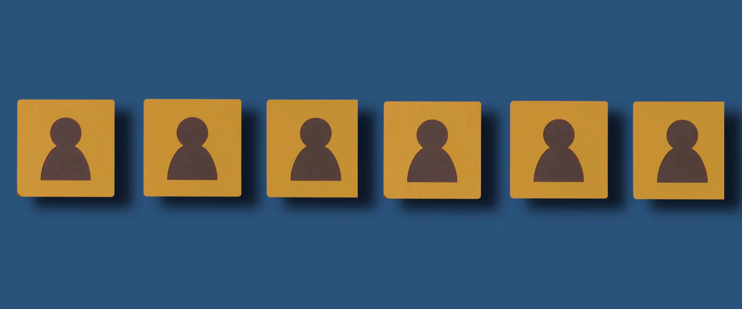 A row of blocks sits on a blue background. The blocks have the silhouettes of figures on them.