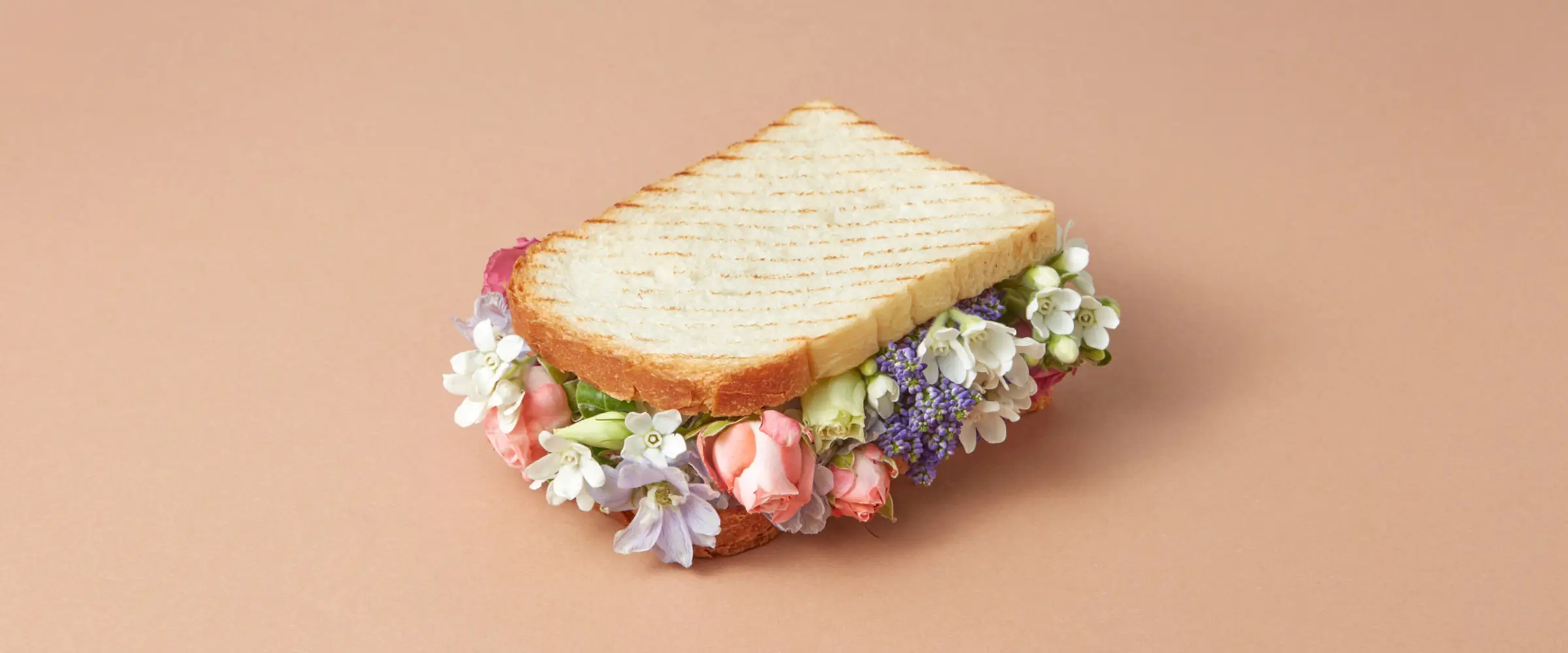 A grilled sandwich filled with fresh flowers.