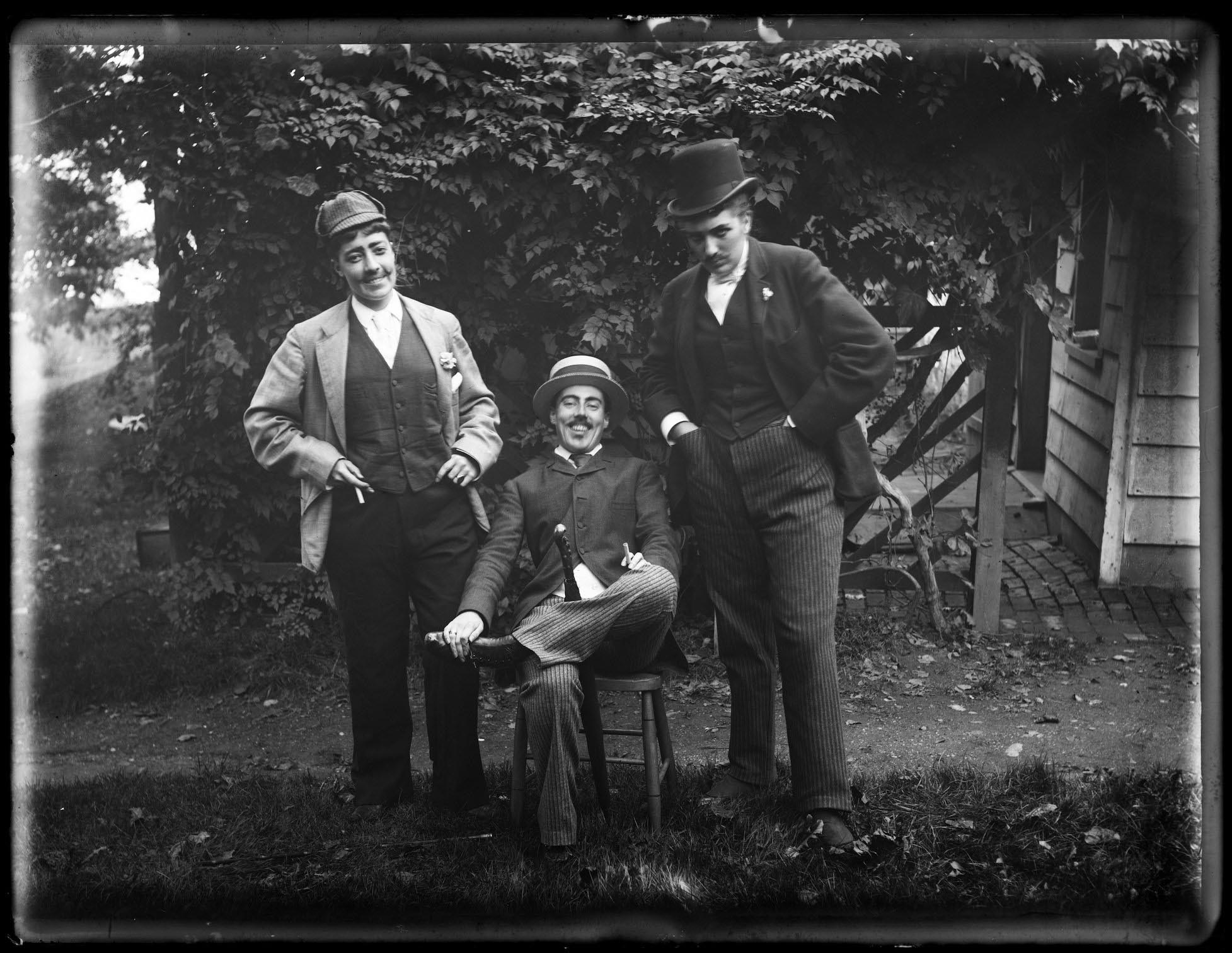 1891, Julia Martin, Julia Bredt, and Alice Austen, seated, dressed as men with mustaches. Austen Photo Collection, Staten Island