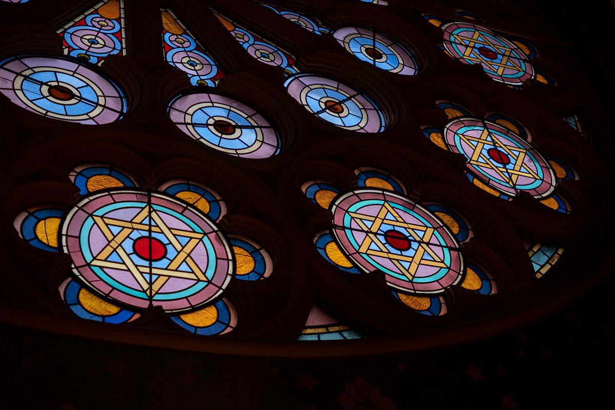 Close-up of stained glass art featuring Jewish stars.