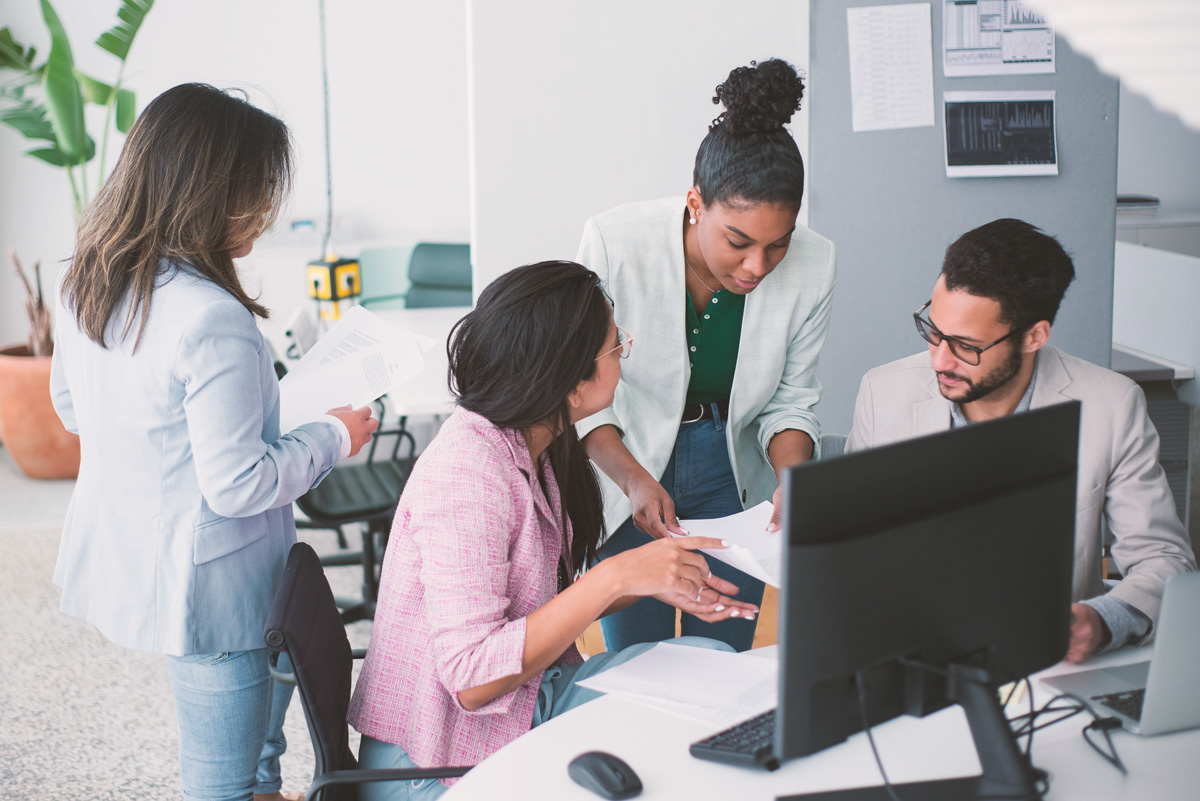 An image of coworkers discussion diversity, equity and inclusion
