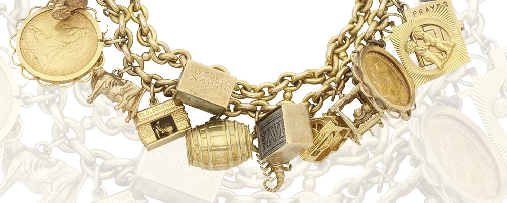 Gold charm bracelets sold at Aubreys Auctioneers