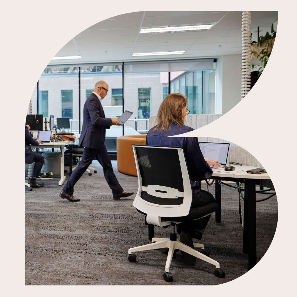 Seisma team members working in a modern open-plan office