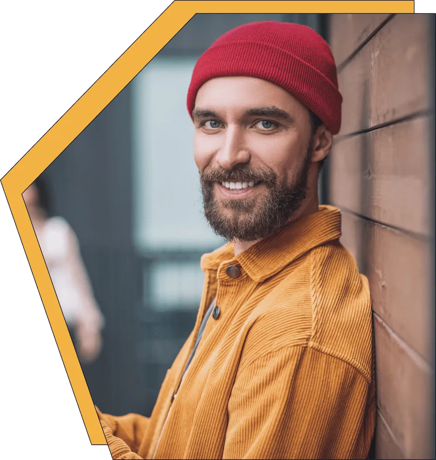 An image of a young man, smiling.