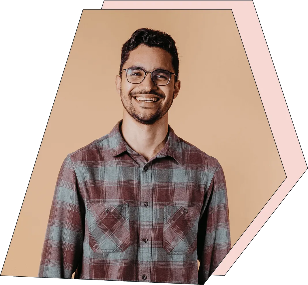 An image of a young man smiling at the camera.