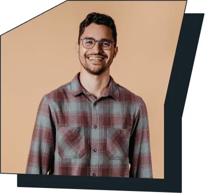 An image of a young man smiling at the camera.