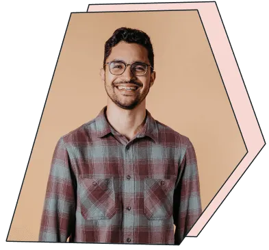 An image of a young man smiling at the camera.