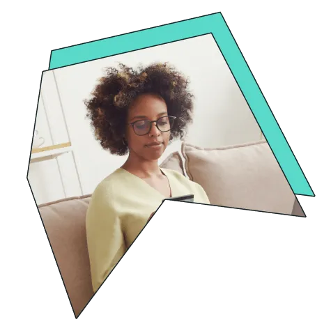 An image of a woman on her phone, smiling.