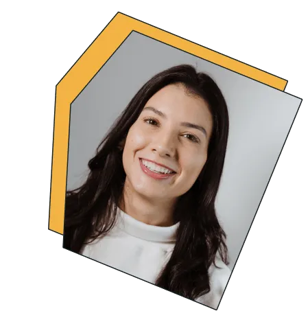 An image of a young woman smiling at the camera.