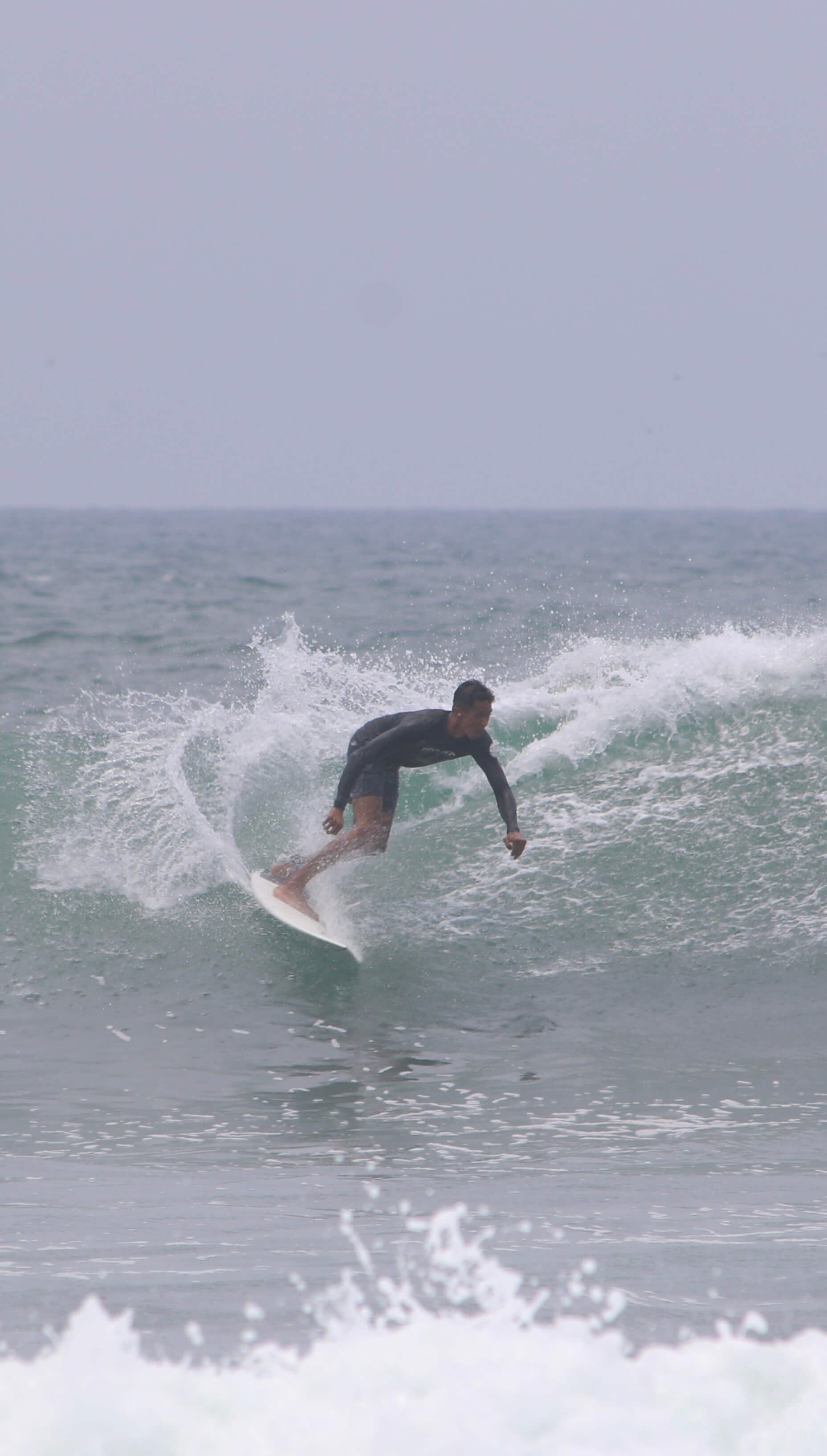 me surfing in El Salvador