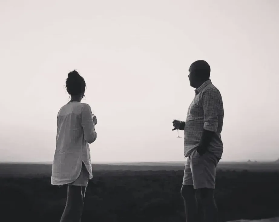 The founders of Wilderness Seekers, Lucy Blunt and Neil Stuckenberg, standing side by side at a Wilderness Seekers destination in Africa.