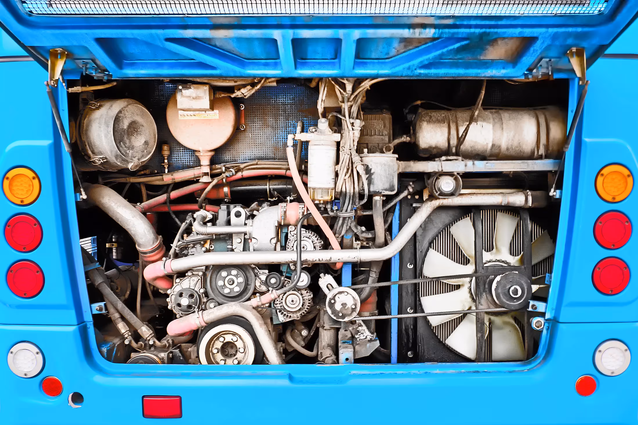 Diesel mechanic performing bus repair services from repair shop in Leduc, AB