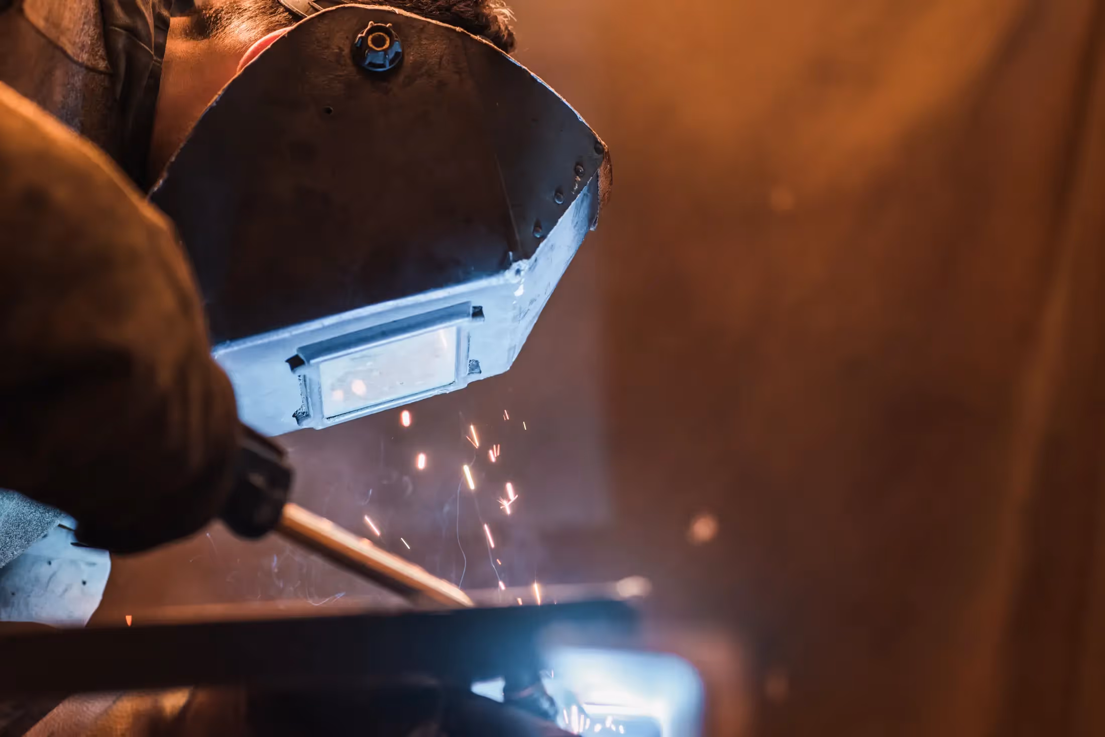 Diesel mechanic performing welding services for semi-truck in Leduc, AB