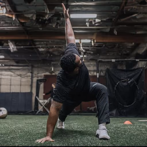 Black man with black shirt doing exercise