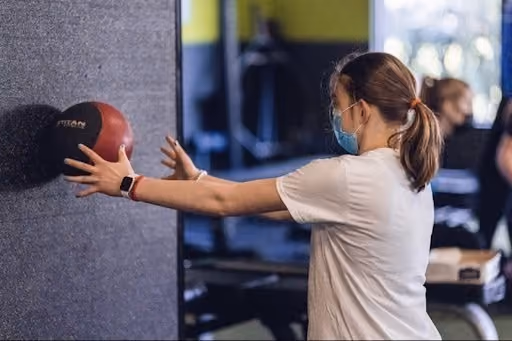 Woman throwing the ball into the wall
