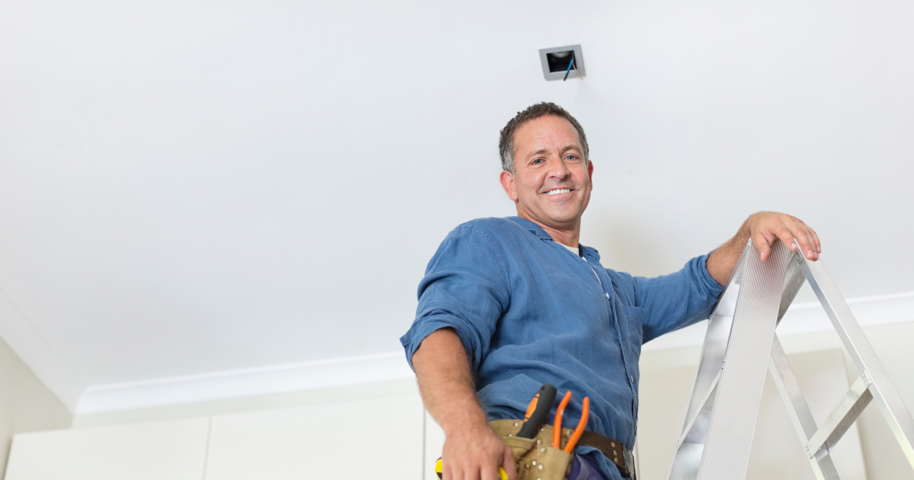 A worker on the ladder