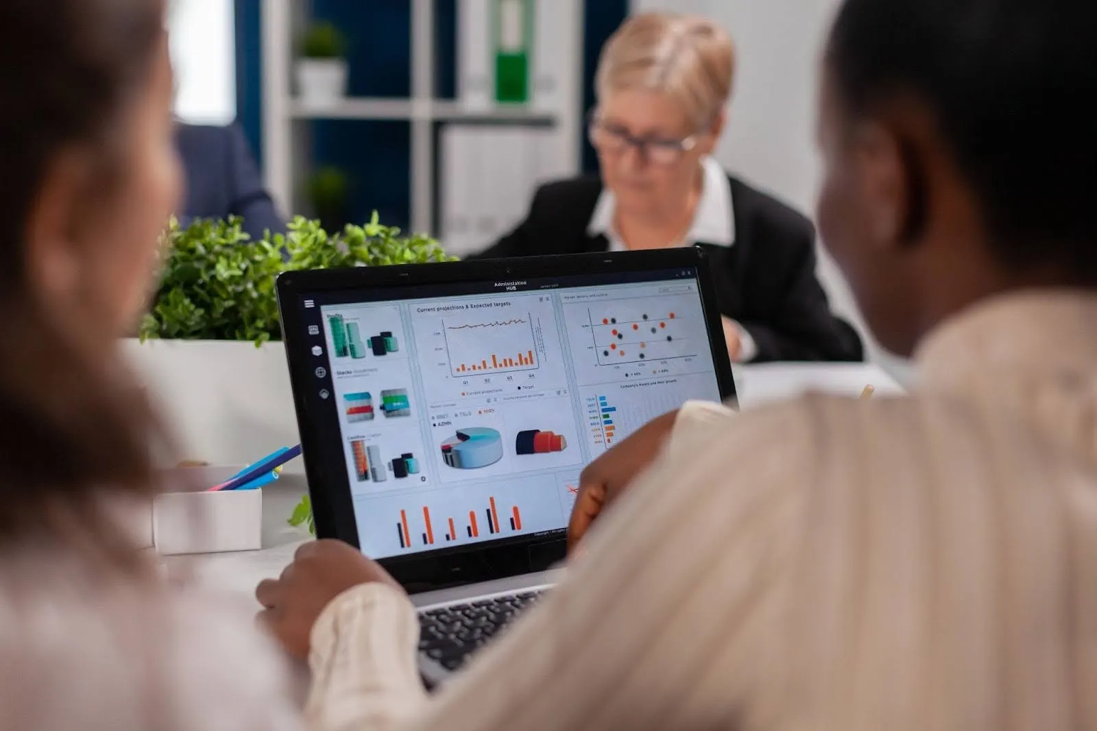 professionals reviewing key features of the company's resource management plan