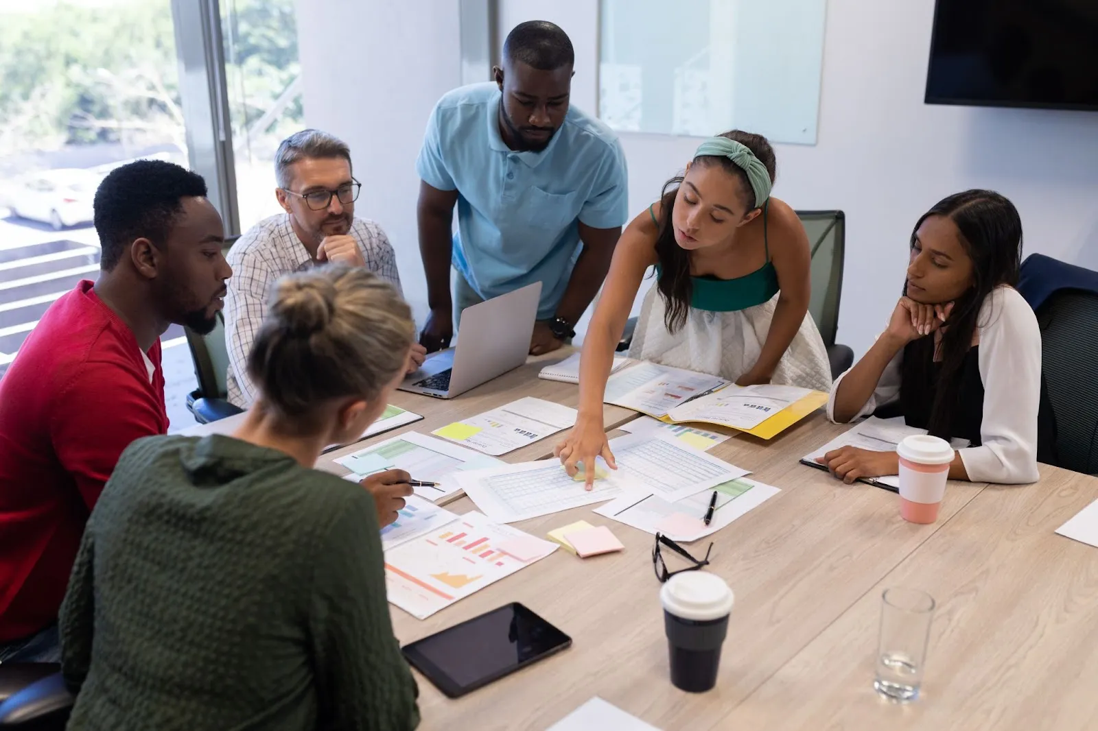 group of project portfolio managers discussing work