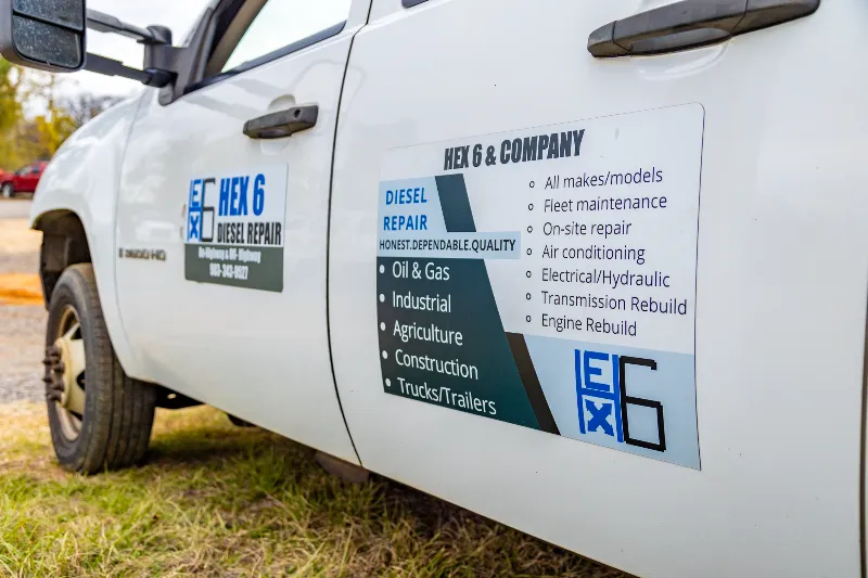Diesel repair service truck with HEX 6 & Company logo and a list of repair specialties on the door panel.