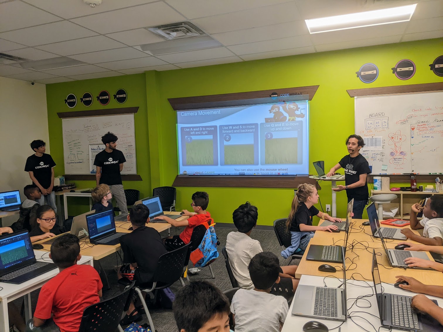 Campers focused on a Minecraft project