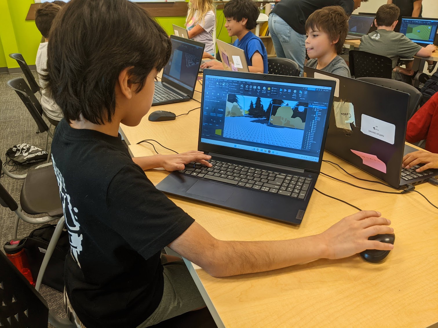 Camper coding on a laptop at Code Ninjas