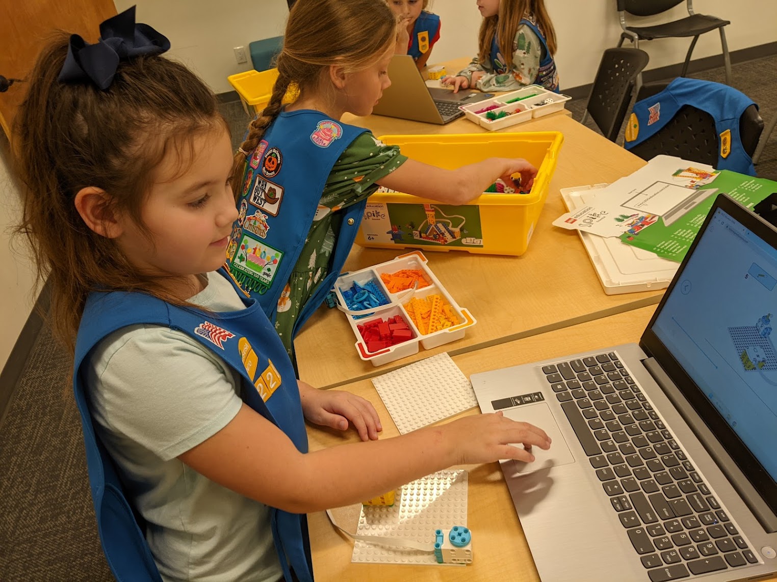 Scouts working through a coding project