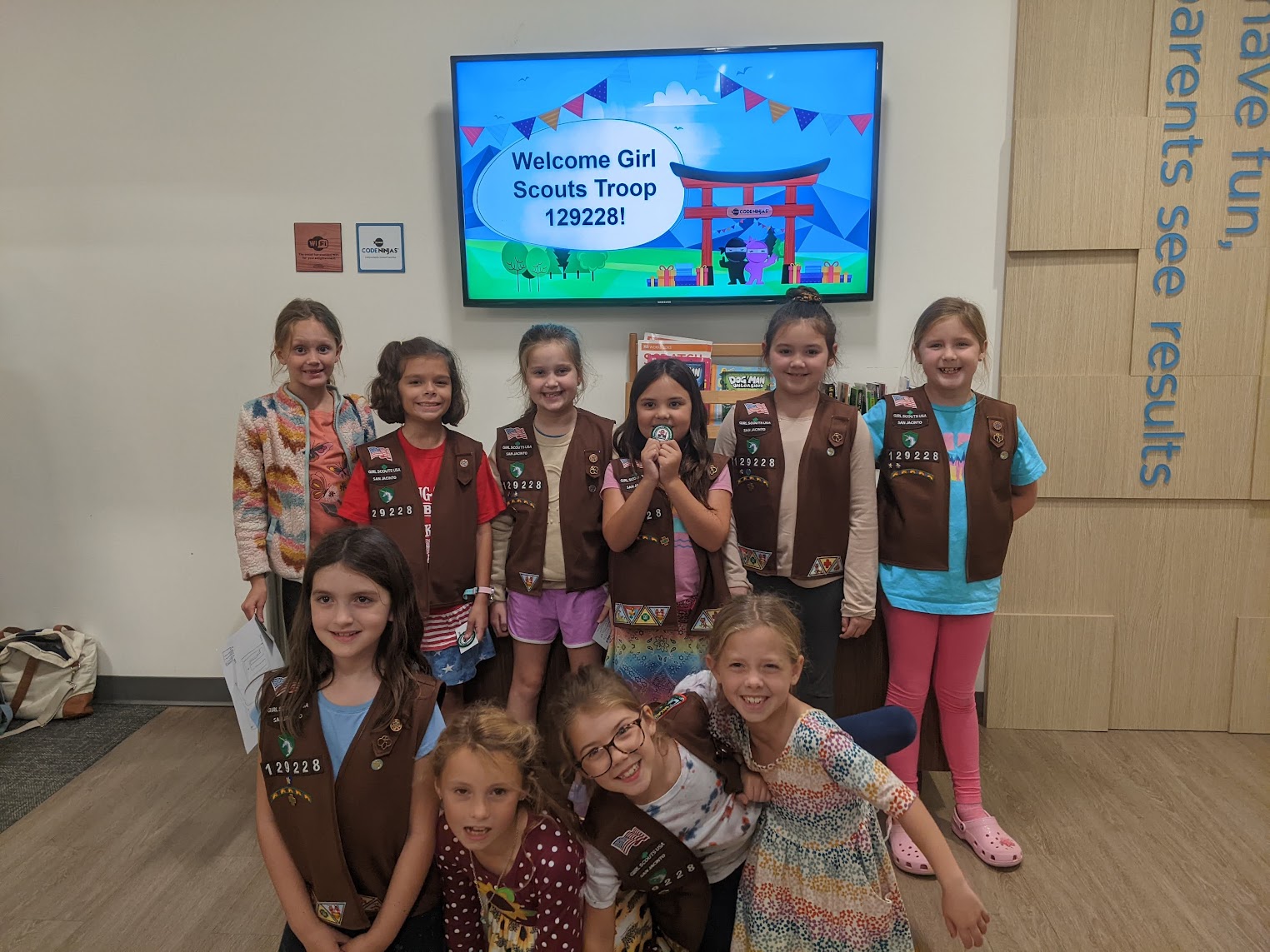 Scouts focused on their laptops during a session
