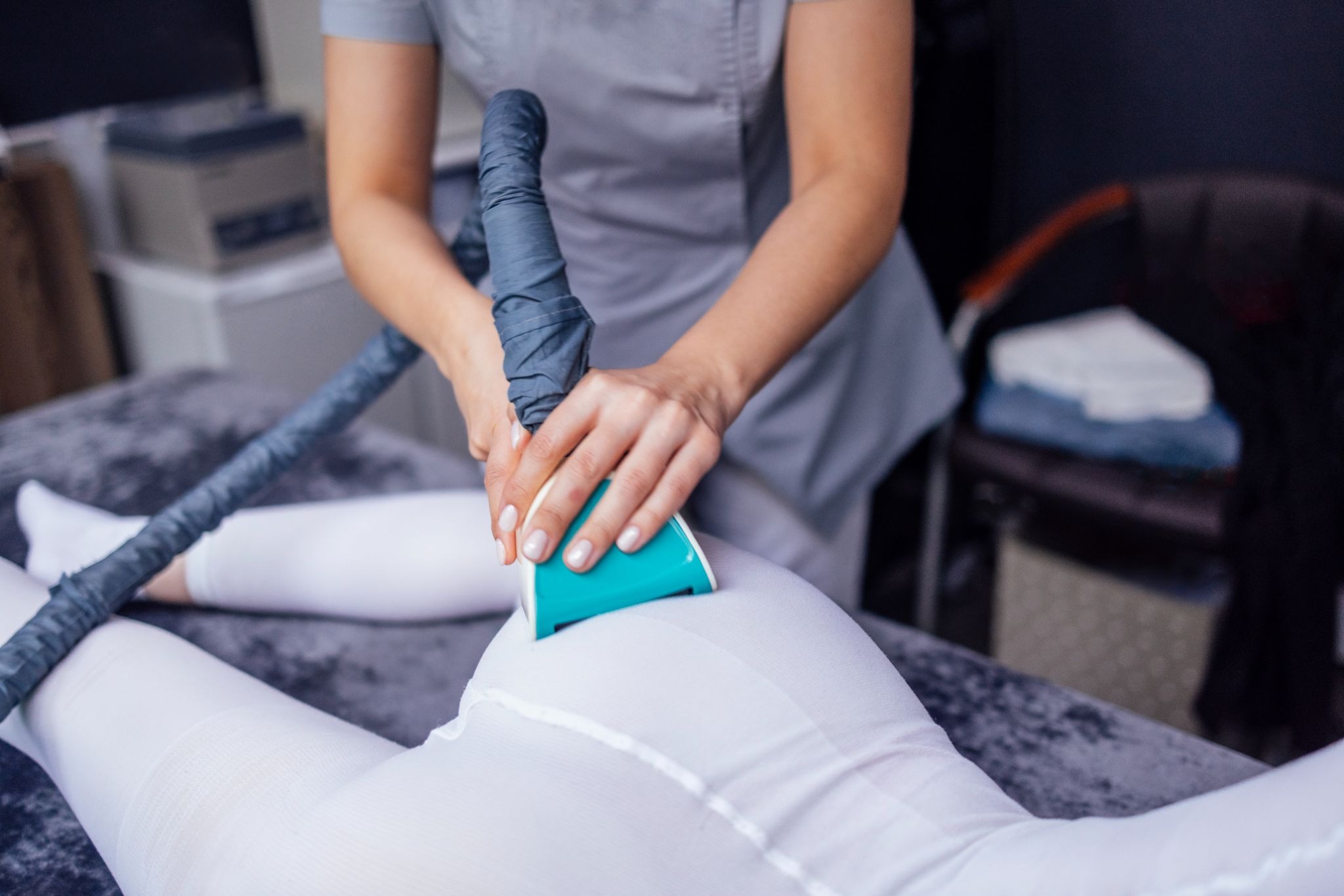 A woman receiving a professional slimming treatment to help reduce cellulite