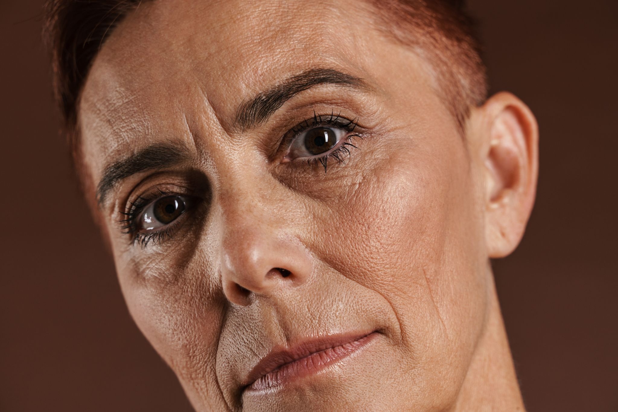 Close-up of a mature female face showing skin texture and wrinkle patterns