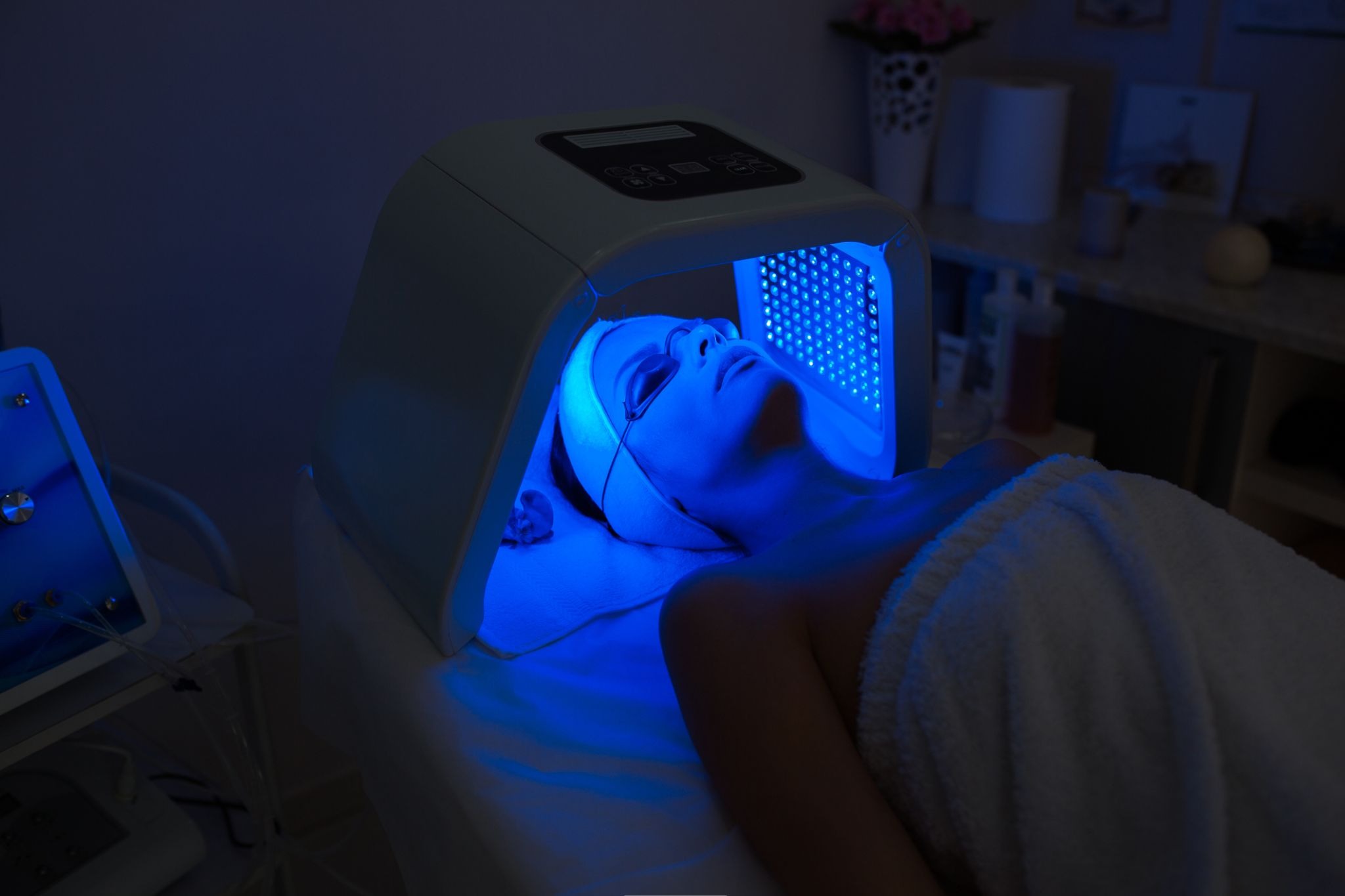 Woman undergoing blue light skin therapy for a clearer complexion and reduced breakouts
