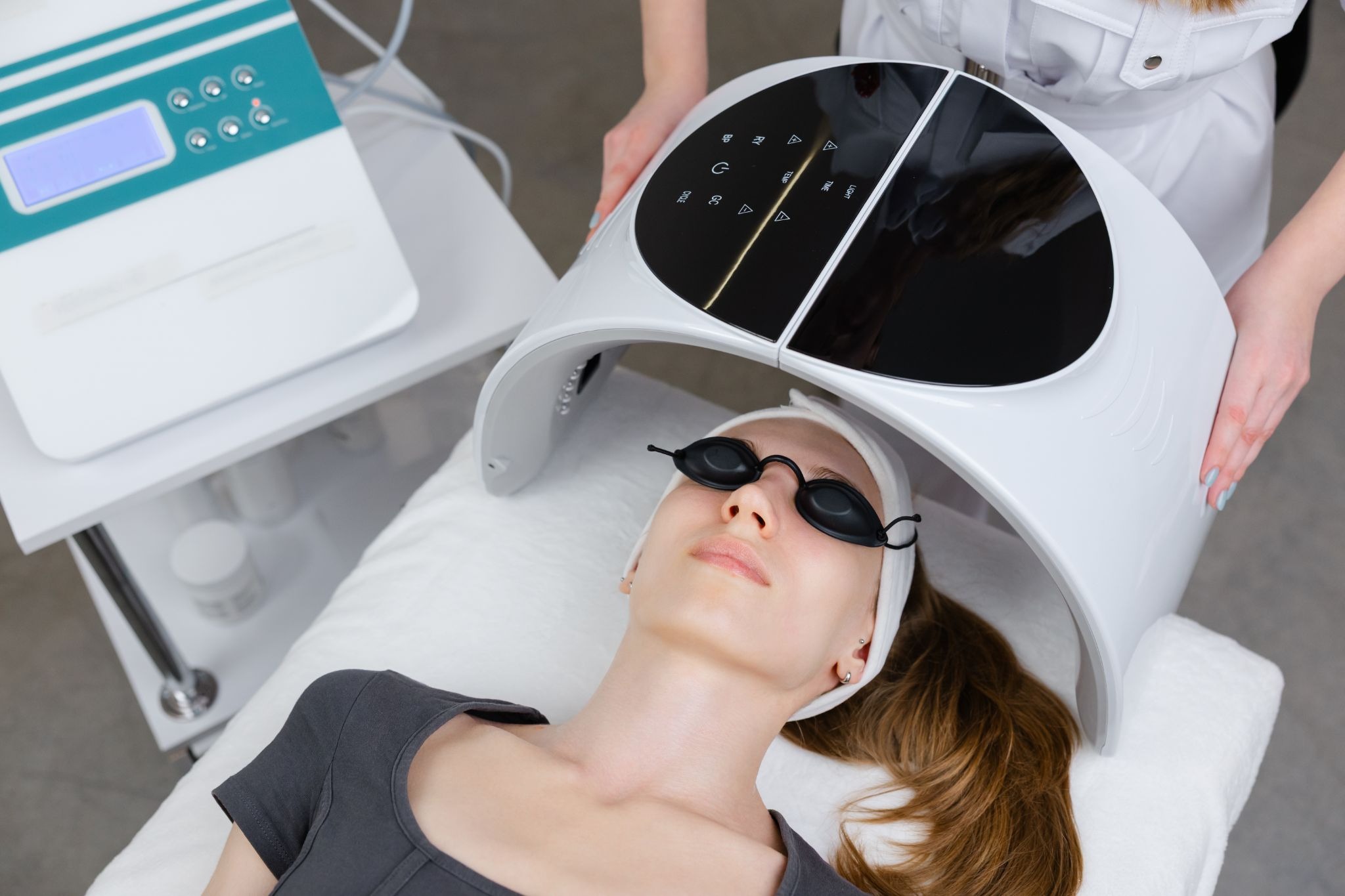 Woman getting ready for an LED light therapy session in a medspa