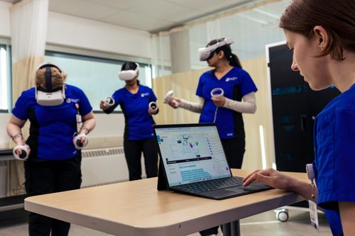 A Chemist professor with a student in a chemistry lab.