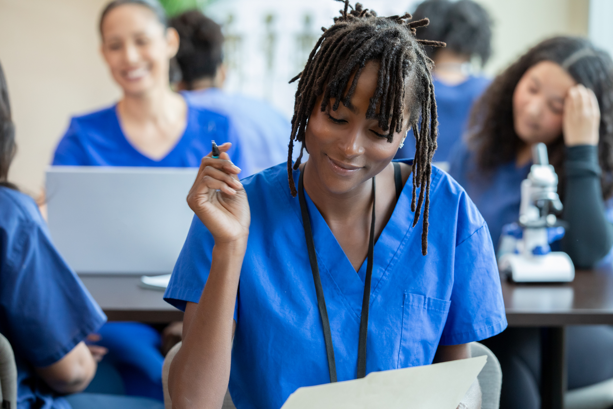 A Chemist professor with a student in a chemistry lab.