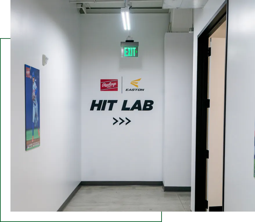 Directional office hallway signage for Hit Lab with Rawlings and Easton logos and arrow graphics under EXIT sign