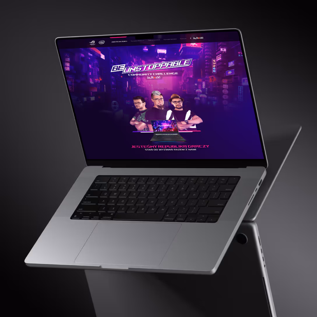 Laptop z ekranem wyświetlającym grafikę promującą wyzwanie społecznościowe 'Be Unstoppable' z trzema mężczyznami na tle futurystycznego miasta.