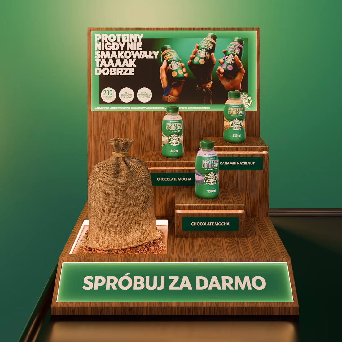 Ekspozycja zielonych butelek napoju białkowego Starbucks Protein Drink 206 z kawą na drewnianym stojaku.