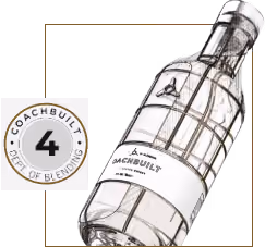 Transparent bottle tilted to the right with Coachbuilt label and a circular emblem showing 'Coachbuilt Dept of Blending 4'.