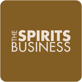 The Spirits Business logo with white text on a brown background.
