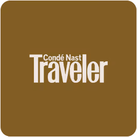 Condé Nast Traveler logo on a brown background.