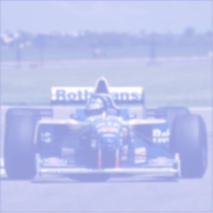 Front view of a Formula 1 racing car with Rothmans sponsorship on a race track.