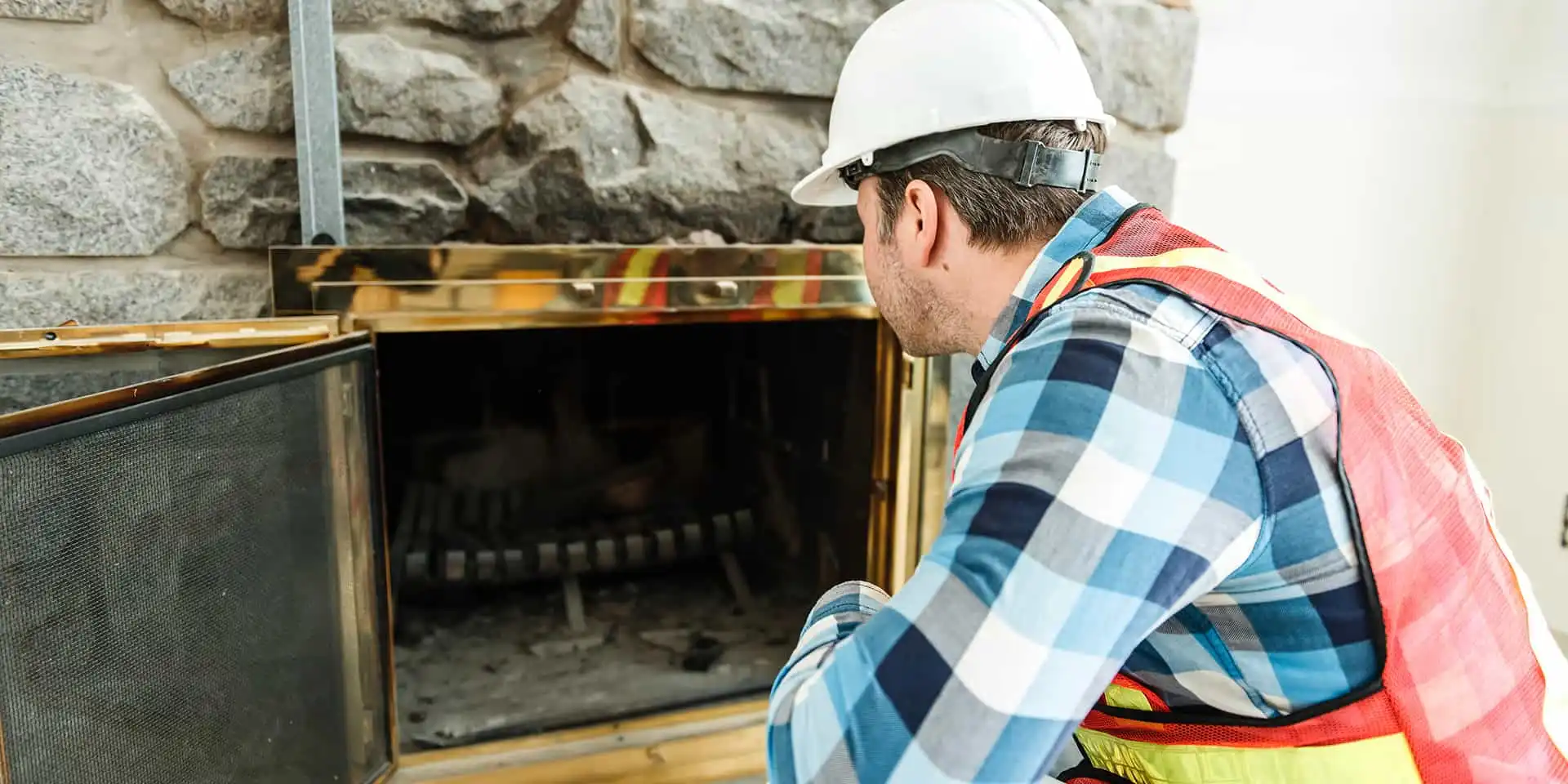 Technician assessing a customers fireplace for safety and code compliance.