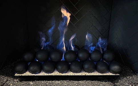 Vented gas fireball burner installation with a modern flame presentation and smooth fireballs.