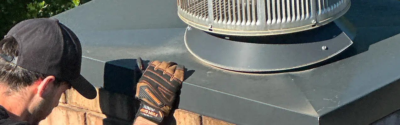 Professional chimney inspection performed by a certified technician on a residential roof