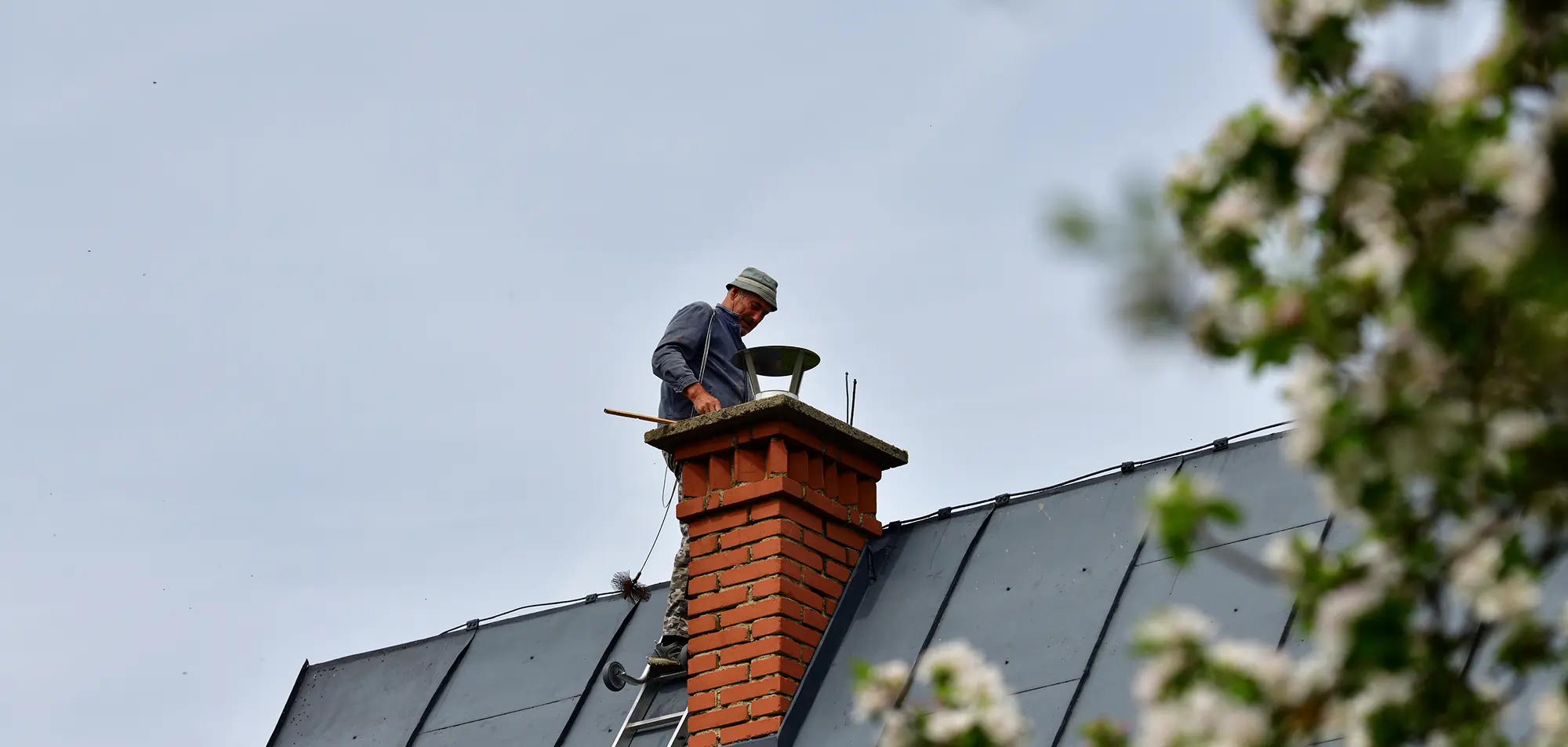 Professional chimney inspection assessing flue condition, chimney structure, and roofline safety