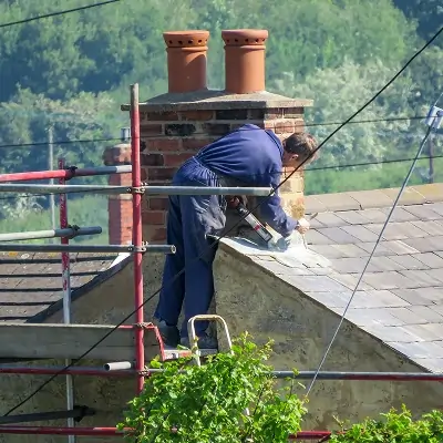 Chimney repair in progress focusing on masonry restoration and flashing repair