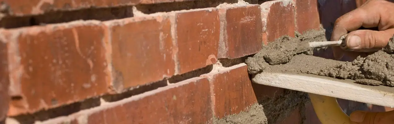 Professional chimney inspection performed by a certified technician on a residential roof