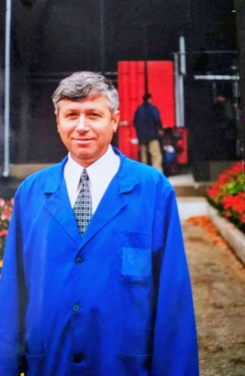 Archival portrait of Ion Luca Sr. in his winery work coat